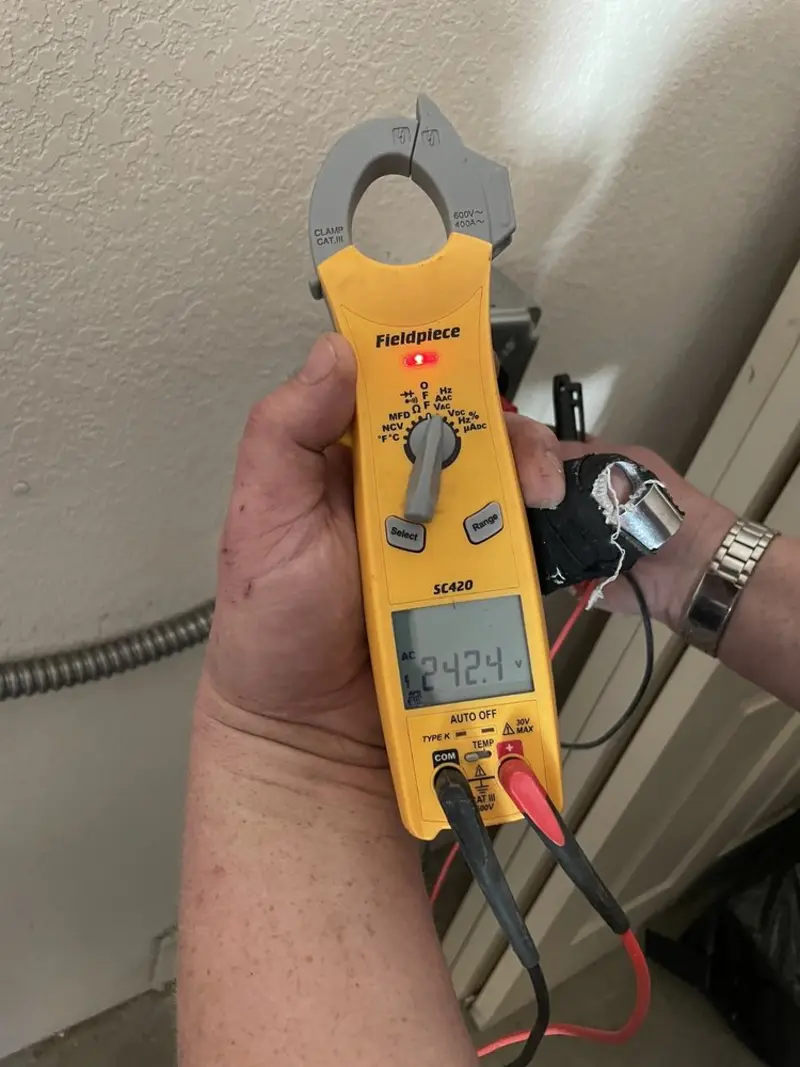 Voltage testing with clamp meter during Whole House Surge Protector in Florence